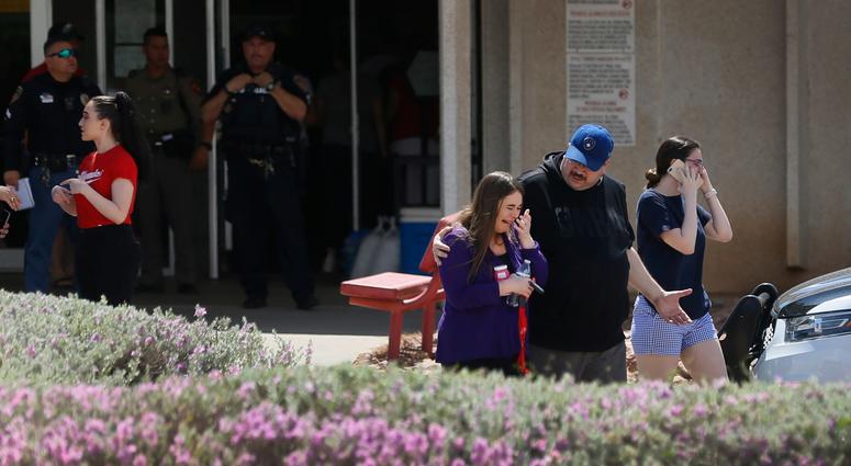 People arrive at MacArthur Elementary looking for family and friends as the school is being used a re-unification center during the aftermath of a shooting at the Walmart in the Cielo Vista Mall area Saturday, Aug. 3, 2019 in El Paso, Texas. El Paso shooting