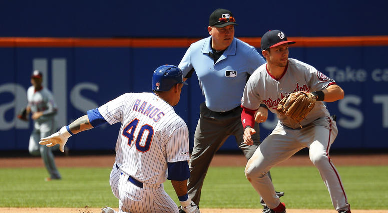 New York Mets catcher Wilson Ramos (40) slides safely into second base after hitting a double against the Washington Nationals during the fourth inning at Citi Field. Mets