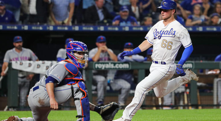 Kansas City Royals first baseman Ryan O'Hearn (66) scores ahead of the tag by New York Mets catcher Tomas Nido (3) during the fifth inning at Kauffman Stadium. Royals Mets