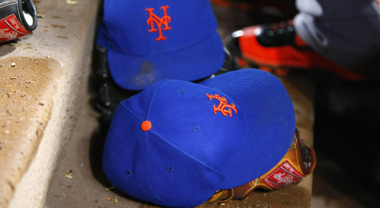 Detailed view of New York Mets hats in the dugouts New York Mets Hats