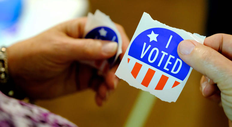 Volunteers pass "I Voted" stickers I Voted Sticker