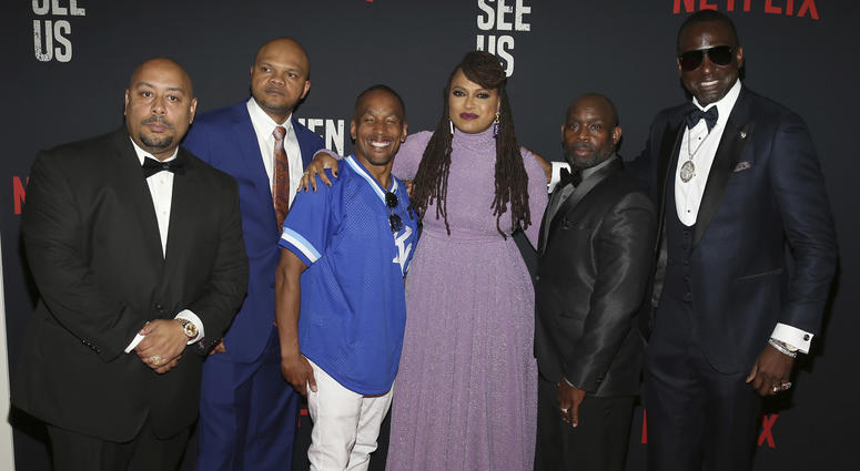 In this May 20, 2019 file photo, Director Ava DuVernay, center, with the Central Park 5: Raymond Santana, from left, Kevin Richardson, Korey Wise, Anthony McCray and Yuesf Salaam, attend the world premiere of "When They See Us," at the Apollo Theater Central Park 5