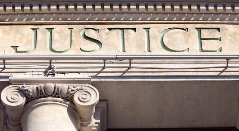 Justice sign on a Courtroom Building Court house