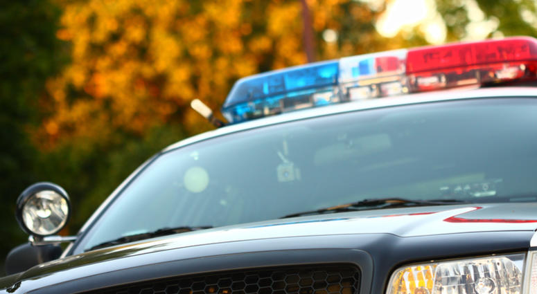 Front view of police car with siren and windshield Front view of police car with siren and windshield