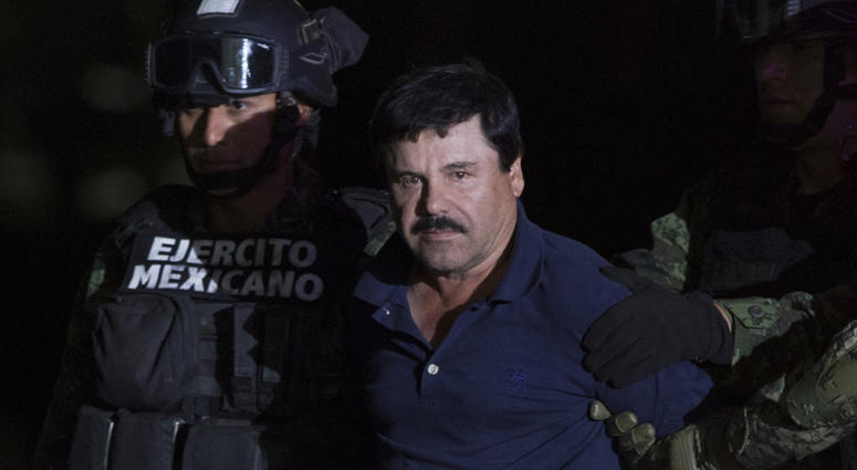 Soldiers escort Joaquin Guzman Loera, alias "El Chapo", upon his arrival to the hangar of the Attorney General's Office, in Mexico City, capital of Mexico, on Jan. 8, 2016. Joaquin “El Chapo” Guzman