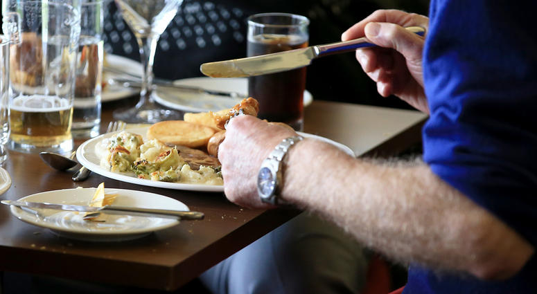 Man eating at a restaurant man eating