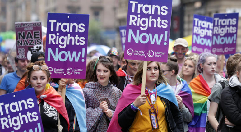 People carrying Trans rights banners take part in the Pride Glasgow parade through the city centre. LGBT Trans Rights