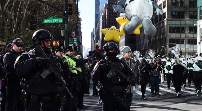 Police officers stand guard during the 2017 Macy's Thanksgiving Day Parade in New York, the United States, on Nov. 23, 2017. Thanksgiving Parade Security