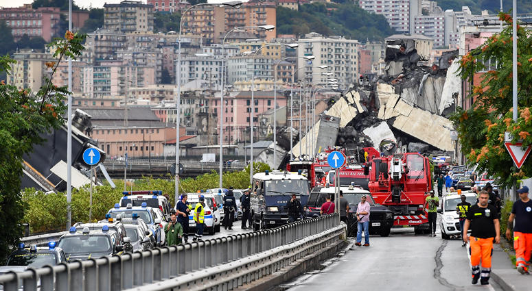 Photo taken on Aug. 14, 2018 shows a partially collapsed bridge in Genoa, Italy. Built in the 1960s, the Morandi Bridge is a major connection for the port city of Genoa. Italy Bridge Collapse
