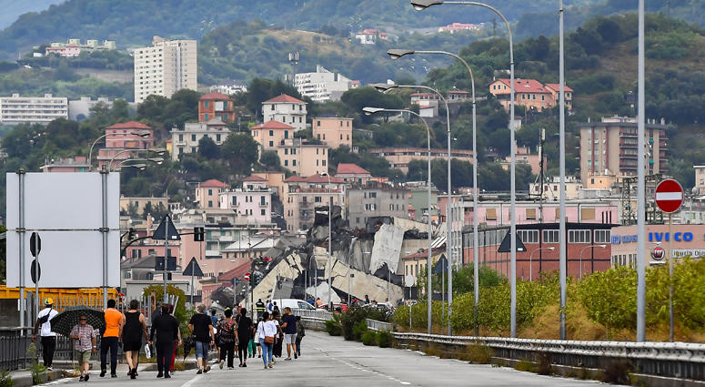 Photo taken on Aug. 14, 2018 shows a partially collapsed bridge in Genoa, Italy. Built in the 1960s, the Morandi Bridge is a major connection for the port city of Genoa. Italy Bridge Collapse