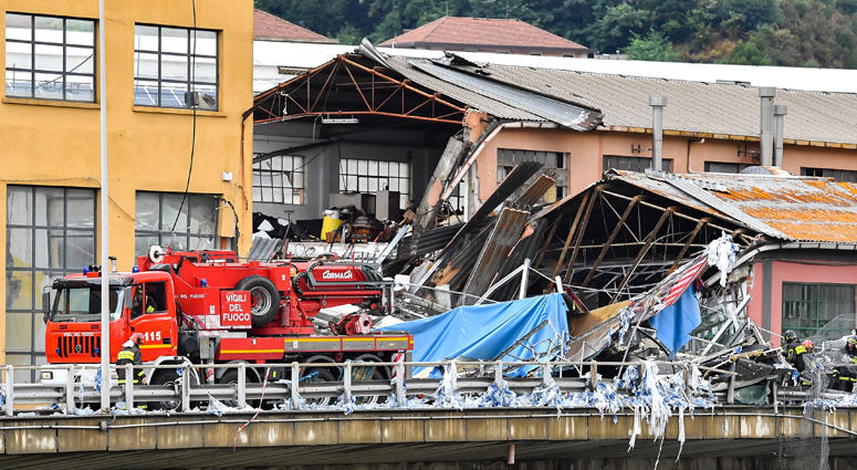 Photo taken on Aug. 14, 2018 shows a partially collapsed bridge in Genoa, Italy. Built in the 1960s, the Morandi Bridge is a major connection for the port city of Genoa. Italy Bridge Collapse