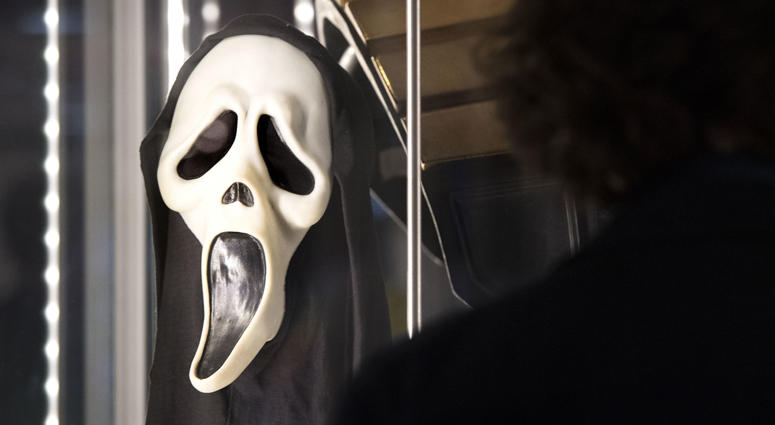 A Ghostface mask used in Scream (1996) at the Prop Store film memorabilia exhibition at the BFI IMAX at Waterloo in central London Scream Mask