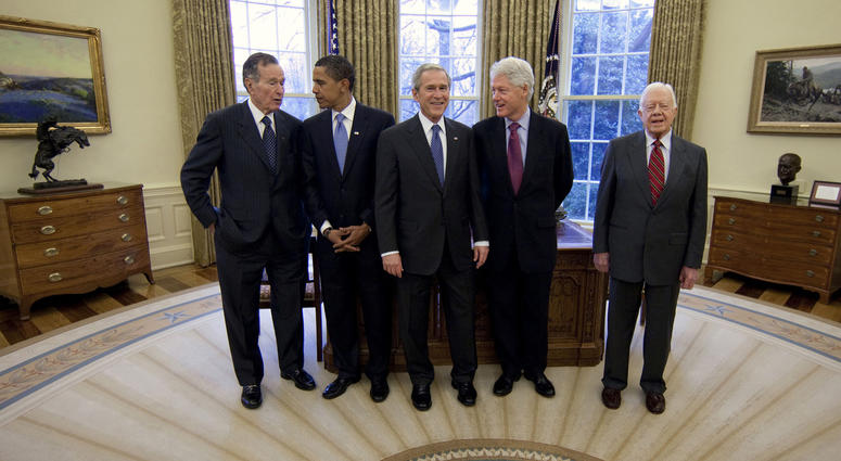 Then-President George W. Bush, center, meets with former President George H.W. Bush, left, then-President-elect Barack Obama, second from left, former President Bill Clinton, second from right, and former President Jimmy Carter, January 7, 2009. George H.W. Bush