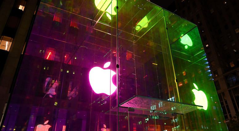 View of the Apple Computer Inc. logo in iridescent colors through soon to be open glass cube entrance of the Fifth Avenue store in New York, NY, seen on September 6, 2019. Apple Store Fifth Avenue