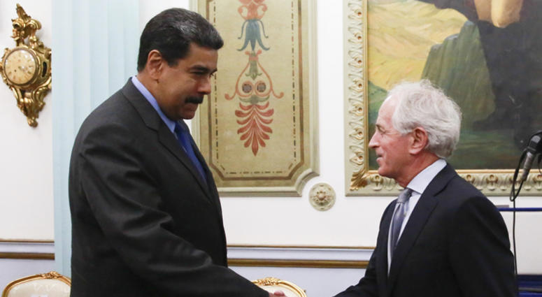In this photo released by the Miraflores Presidential Press Office, Venezuela's President Nicolas Maduro, left, shakes hands with Republican Senator Bob Corker during a meeting at the Miraflores Presidential Palace in Caracas, In this photo released by the Miraflores Presidential Press Office, Venezuela's President Nicolas Maduro, left, shakes hands with Republican Senator Bob Corker during a meeting at the Miraflores Presidential Palace in Caracas,