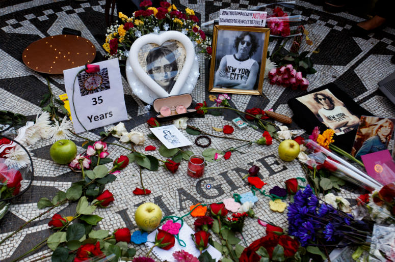Photos and flowers are placed in Central Park's Strawberry Field to commemorate John Lennon's death Photos and flowers are placed in Central Park's Strawberry Field to commemorate John Lennon's death