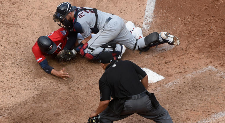 Adrianza is thrown out at home Indians throw out Adrianza at the plate
