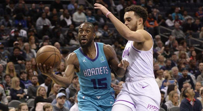 Kemba Walker gets by Tyus Jones Timberwolves guard Tyus Jones and Charlotte guard Kemba Walker