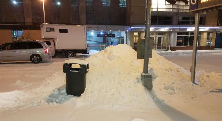 Snow piled on the sidewalk in downtown Minneapolis Heres some snow