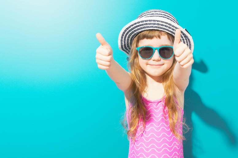 Little happy girl in beach outfit Little happy girl in beach outfit