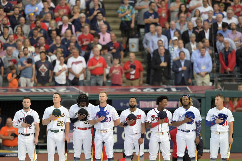The participants stand for the National Anthem prior to the 2019 MLB Home Run Derby at Progressive Field. The participants stand for the National Anthem prior to the 2019 MLB Home Run Derby at Progressive Field.