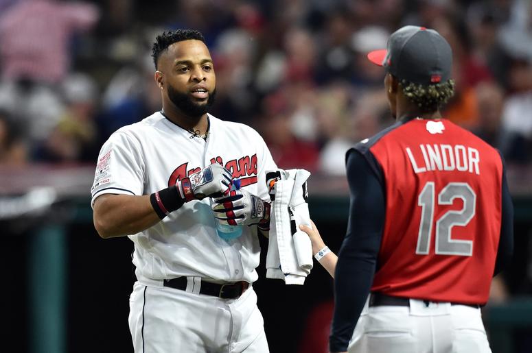 Cleveland Indians first baseman Carlos Santana (41) talks with teammate Francisco Lindor during the first round in the 2019 MLB Home Run Derby at Progressive Field. Cleveland Indians first baseman Carlos Santana (41) talks with teammate Francisco Lindor during the first round in the 2019 MLB Home Run Derby at Progressive Field.
