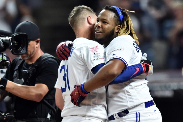 Los Angeles Dodgers outfielder Joc Pederson (31) and Toronto Blue Jays third baseman Vladimir Guerrero Jr. (27) hug after the second round overtime in the 2019 MLB Home Run Derby at Progressive Field. Los Angeles Dodgers outfielder Joc Pederson (31) and Toronto Blue Jays third baseman Vladimir Guerrero Jr. (27) hug after the second round overtime in the 2019 MLB Home Run Derby at Progressive Field.
