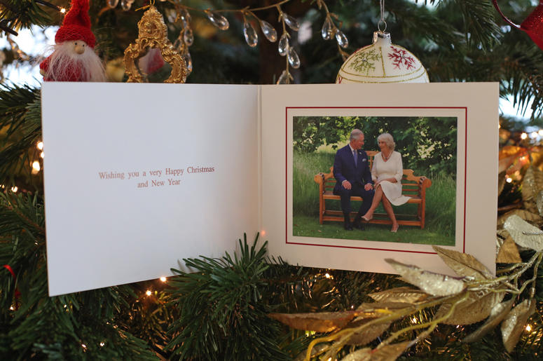 The 2018 Christmas card of the Prince of Wales and Duchess of Cornwall on a Christmas tree in Clarence House, London. The card features a photograph of the royal couple, taken by Hugo Burnand in the gardens of Clarence House. The 2018 Christmas card of the Prince of Wales and Duchess of Cornwall on a Christmas tree in Clarence House, London. The card features a photograph of the royal couple, taken by Hugo Burnand in the gardens of Clarence House.