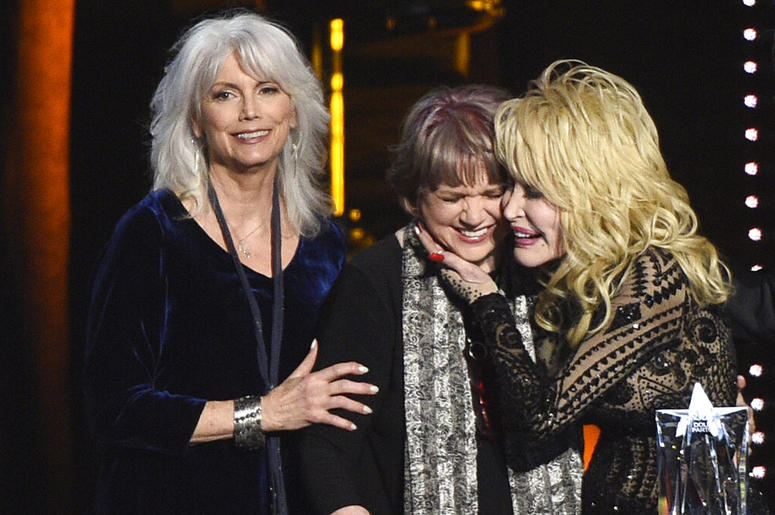 Emmylou Harris, from left, and Linda Ronstadt present Dolly Parton with the MusiCares Person of the Year award on Friday, Feb. 8, 2018 Emmylou Harris, from left, and Linda Ronstadt present Dolly Parton with the MusiCares Person of the Year award on Friday, Feb. 8, 2018