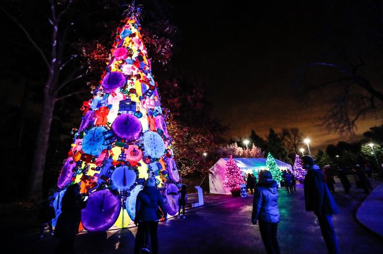 A giant Christmas tree made of plastic toys glows A giant Christmas tree made of plastic toys glows