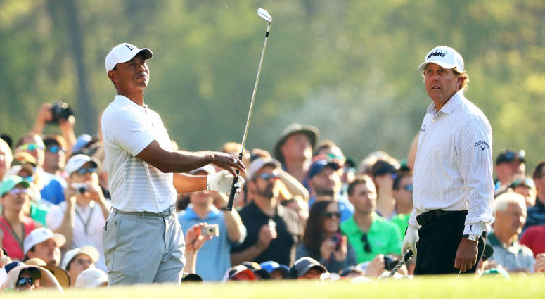 Phil Mickelson watches Tiger Woods play his tee shot on the 12th hole during a practice round for the Masters on April 3, 2018, at Augusta National. Phil Mickelson watches Tiger Woods play his tee shot on the 12th hole during a practice round for the Masters on April 3, 2018, at Augusta National.