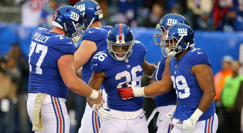 Nov 18, 2018; East Rutherford, NJ, USA; New York Giants running back Saquon Barkley (26) celebrates his touchdown with teammates during the second half at MetLife Stadium. Mandatory Credit: Vincent Carchietta-USA TODAY Sports Nov 18, 2018; East Rutherford, NJ, USA; New York Giants running back Saquon Barkley (26) celebrates his touchdown with teammates during the second half at MetLife Stadium. Mandatory Credit: Vincent Carchietta-USA TODAY Sports