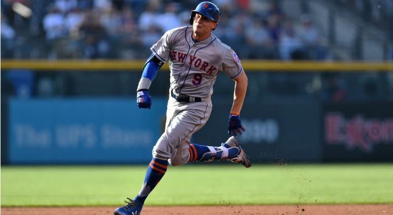 Brandon Nimmo heads to third for an inside the park home run in the first inning against the Colorado Rockies at Coors Field. Brandon Nimmo heads to third for an inside the park home run in the first inning against the Colorado Rockies at Coors Field.
