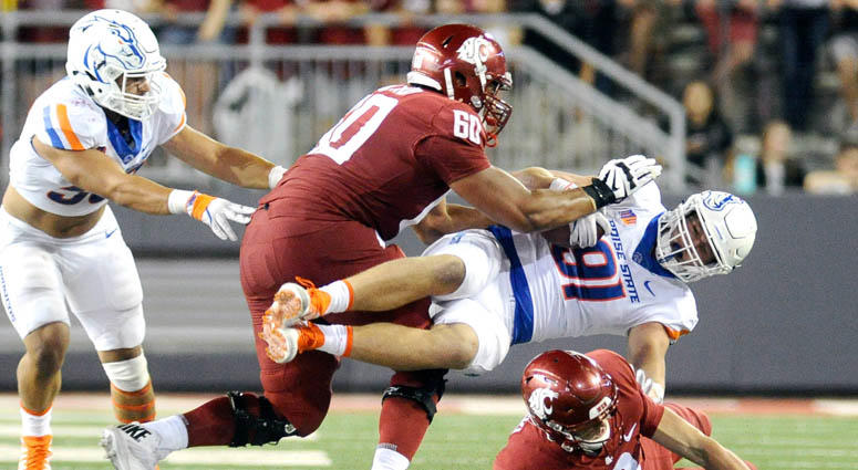 Washington State offensive lineman Andre Dillard (60) takes out Boise State defensive end Durrant Miles on a block on Sept. 7, 2017, at Martin Stadium in Pullman, Washington. Washington State offensive lineman Andre Dillard (60) takes out Boise State defensive end Durrant Miles on a block on Sept. 7, 2017, at Martin Stadium in Pullman, Washington.