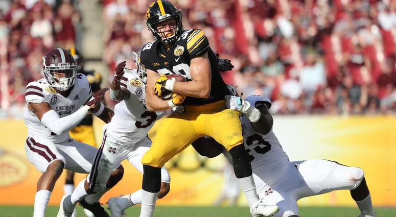 Iowa Hawkeyes tight end T.J. Hockenson (38) runs with the ball as Mississippi State Bulldogs cornerback Cameron Dantzler (3) defends during the second half in the 2019 Outback Bowl at Raymond James Stadium. Mandatory Credit: Kim Klement-USA TODAY Sports Iowa Hawkeyes tight end T.J. Hockenson (38) runs with the ball as Mississippi State Bulldogs cornerback Cameron Dantzler (3) defends during the second half in the 2019 Outback Bowl at Raymond James Stadium. Mandatory Credit: Kim Klement-USA TODAY Sports