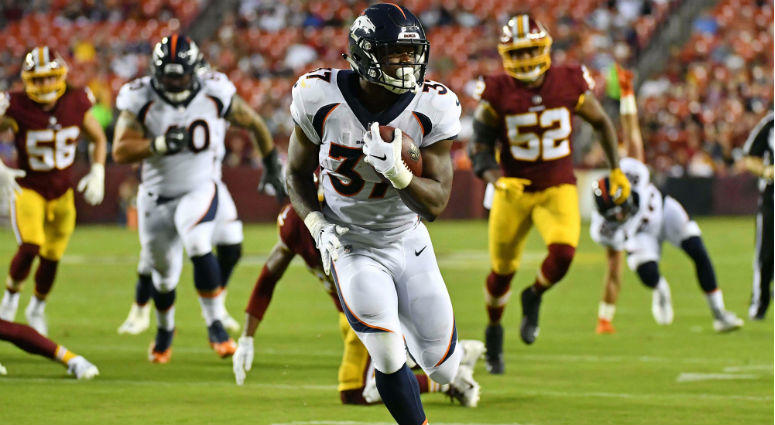 Royce Freeman runs for a touchdown against the Washington Redskins during the first half at FedEx Field. Royce Freeman runs for a touchdown against the Washington Redskins during the first half at FedEx Field.