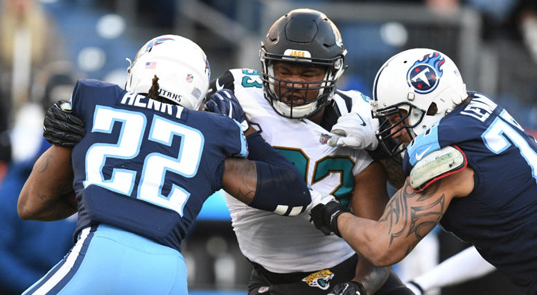 Titans running back Derrick Henry (22) is tackled for a loss by Jacksonville Jaguars defensive lineman Calais Campbell (93) on Dec. 31, 2017, at Nissan Stadium in Nashville. Titans running back Derrick Henry (22) is tackled for a loss by Jacksonville Jaguars defensive lineman Calais Campbell (93) on Dec. 31, 2017, at Nissan Stadium in Nashville.