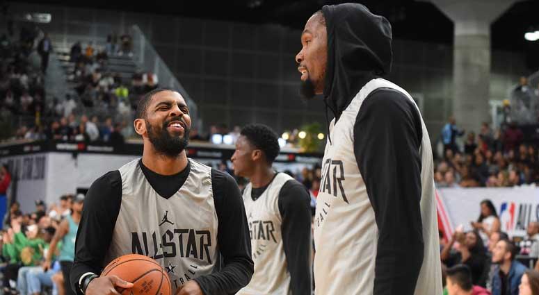 Kevin Durant and Kyrie Irving talk at the 2018 NBA All-Star Game. Kevin Durant and Kyrie Irving talk at the 2018 NBA All-Star Game.