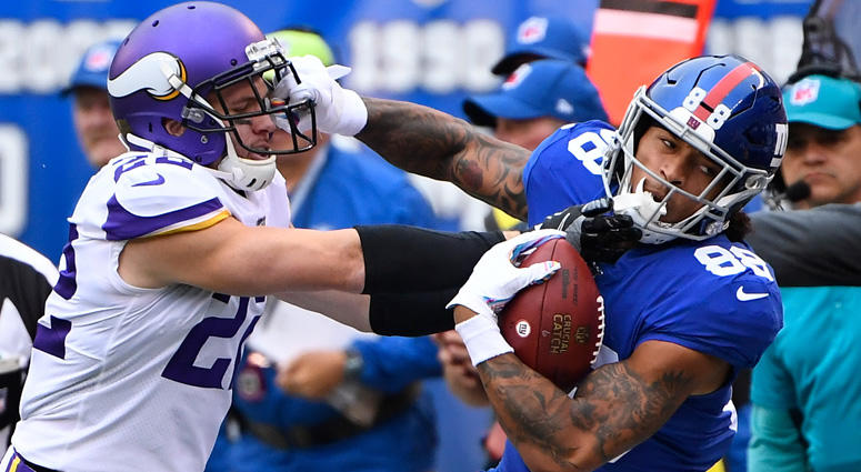 Giants tight end Evan Engram gets a first down in the first quarter as Vikings free safety Harrison Smith defends on Oct. 6, 2019, at MetLife Stadium. Giants tight end Evan Engram gets a first down in the first quarter as Vikings free safety Harrison Smith defends on Oct. 6, 2019, at MetLife Stadium.