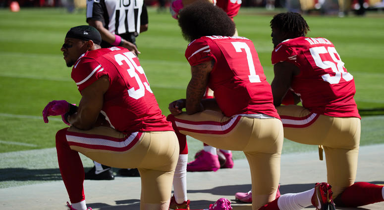 Three 49ers players, including Colin Kaepernick (7), kneel during the national anthem before a 2016 game. Three 49ers players, including Colin Kaepernick (7), kneel during the national anthem before a 2016 game.