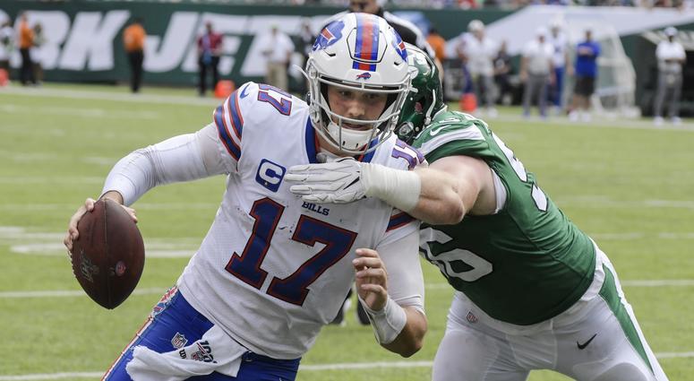 Buffalo Bills' Josh Allen (17) runs past New York Jets' Henry Anderson (96) for a touchdown during the second half of an NFL football game Sunday, Sept. 8, 2019, in East Rutherford, N.J. Buffalo Bills' Josh Allen (17) runs past New York Jets' Henry Anderson (96) for a touchdown during the second half of an NFL football game Sunday, Sept. 8, 2019, in East Rutherford, N.J.