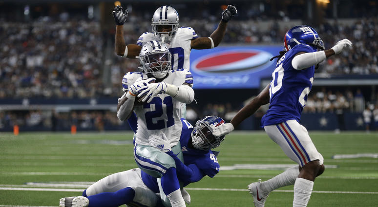 Dallas Cowboys running back Ezekiel Elliott (21) runs the ball for a touchdown after getting past New York Giants outside linebacker Alec Ogletree, center bottom, and Janoris Jenkins, right, as wide receiver Tavon Austin, rear, looks on in the second half Dallas Cowboys running back Ezekiel Elliott (21) runs the ball for a touchdown after getting past New York Giants outside linebacker Alec Ogletree, center bottom, and Janoris Jenkins, right, as wide receiver Tavon Austin, rear, looks on in the second half
