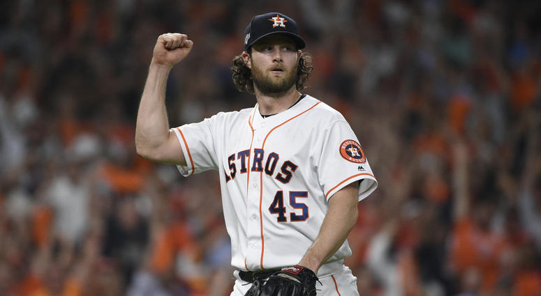 Houston Astros starting pitcher Gerrit Cole (45) reacts after an out against the Tampa Bay Rays during the seventh inning of Game 5 of a baseball American League Division Series in Houston, Houston Astros starting pitcher Gerrit Cole (45) reacts after an out against the Tampa Bay Rays during the seventh inning of Game 5 of a baseball American League Division Series in Houston,