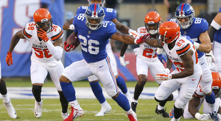 Giants running back Saquon Barkley (26) rushes against the Cleveland Browns on Aug. 9, 2018, at MetLife Stadium. Giants running back Saquon Barkley (26) rushes against the Cleveland Browns on Aug. 9, 2018, at MetLife Stadium.