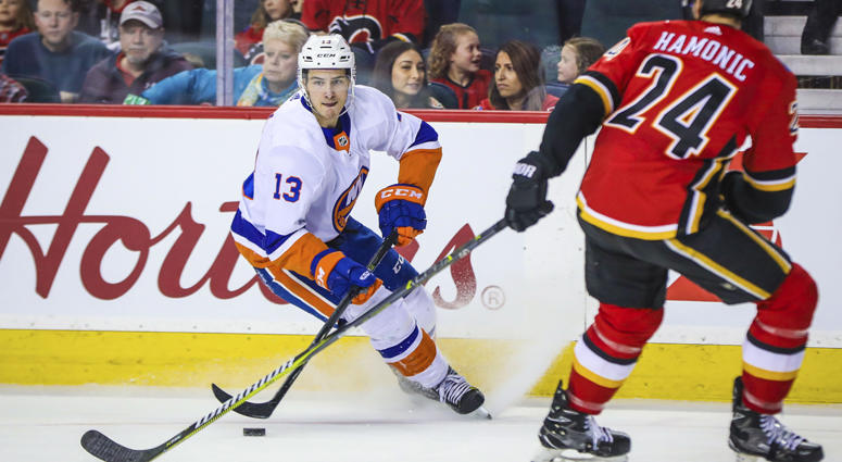 Islanders center Mat Barzal (13) controls the puck against the Flames on March 11, 2018, at Scotiabank Saddledome in Calgary. Islanders center Mat Barzal (13) controls the puck against the Flames on March 11, 2018, at Scotiabank Saddledome in Calgary.