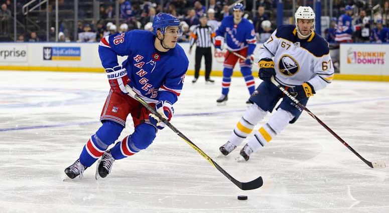 Rangers defenseman Brady Skjei skates past Buffalo Sabres left wing Benoit Pouliot on March 24, 2018, at Madison Square Garden.. Rangers defenseman Brady Skjei skates past Buffalo Sabres left wing Benoit Pouliot on March 24, 2018, at Madison Square Garden..
