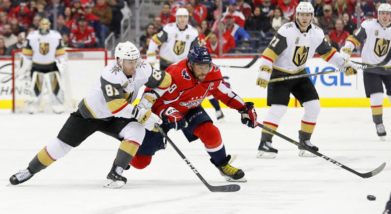Feb 4, 2018; Washington, DC, USA; Vegas Golden Knights center Jonathan Marchessault (81) and Washington Capitals left wing Alex Ovechkin (8) battle for the puck at Capital One Arena. Mandatory Credit: Geoff Burke-USA TODAY Sports