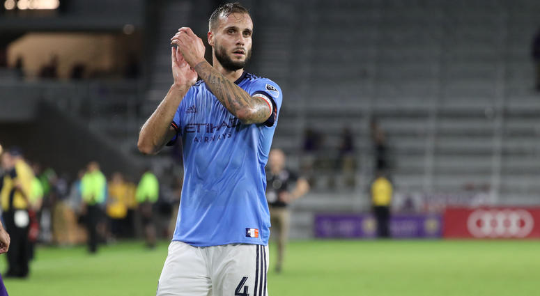 Jul 26, 2018; Orlando, FL, USA; New York City FC defender Maxime Chanot (4) celebrates with fans after defeating the Orlando City SC at Orlando City Stadium. Mandatory Credit: Kim Klement-USA TODAY Sports Jul 26, 2018; Orlando, FL, USA; New York City FC defender Maxime Chanot (4) celebrates with fans after defeating the Orlando City SC at Orlando City Stadium. Mandatory Credit: Kim Klement-USA TODAY Sports
