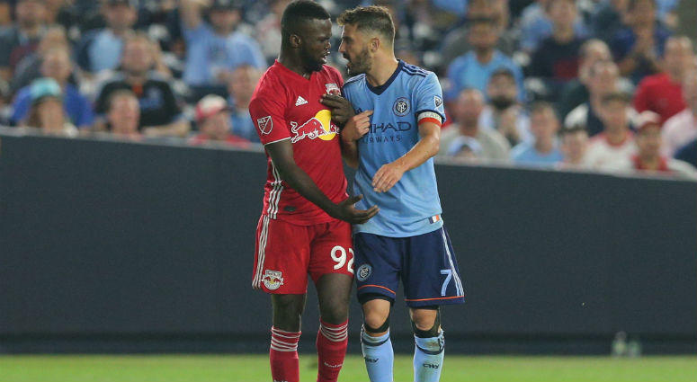 Kemar Lawrence and David Villa exchange words during the second half at Yankee Stadium. Kemar Lawrence and David Villa exchange words during the second half at Yankee Stadium.
