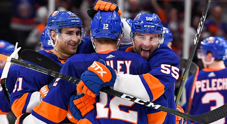 Islanders defenseman Johnny Boychuk (55) celebrates after the game with right wing Josh Bailey (12) and center Valtteri Filppula (51) in the gam against the Pittsburgh Penguins in game one of the first round of the 2019 Stanley Cup Playoffs at Barclays Ce Islanders defenseman Johnny Boychuk (55) celebrates after the game with right wing Josh Bailey (12) and center Valtteri Filppula (51) in the gam against the Pittsburgh Penguins in game one of the first round of the 2019 Stanley Cup Playoffs at Barclays Ce